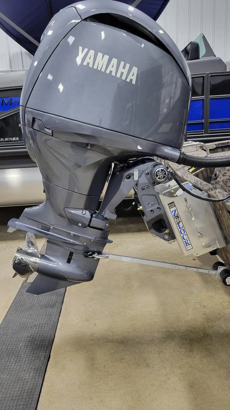 Slide: The Image of 2025 Xpress H210 Bay with Yamaha F150 outboard motor in stock. - 4