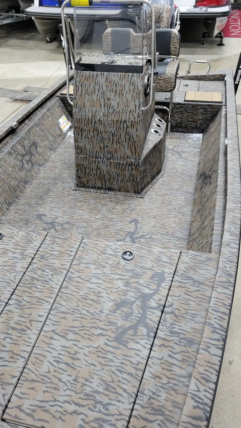 Slide: The Image of 2025 Xpress H210 Bay boat with Yamaha F150, featuring a camouflage design. - 9