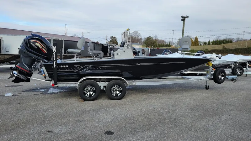 The Image of 2025 Xpress H22 Bay boat with Yamaha Vmax 200 SHO engine on trailer. - 1