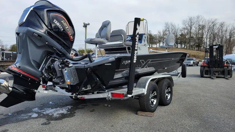 Slide: The Image of 2025 Xpress H22 Bay boat with Yamaha Vmax 200 SHO engine on trailer. - 12