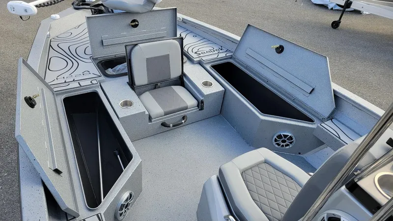 Slide: The Image of 2025 Xpress H22 Bay boat interior with storage compartments and seating. - 15