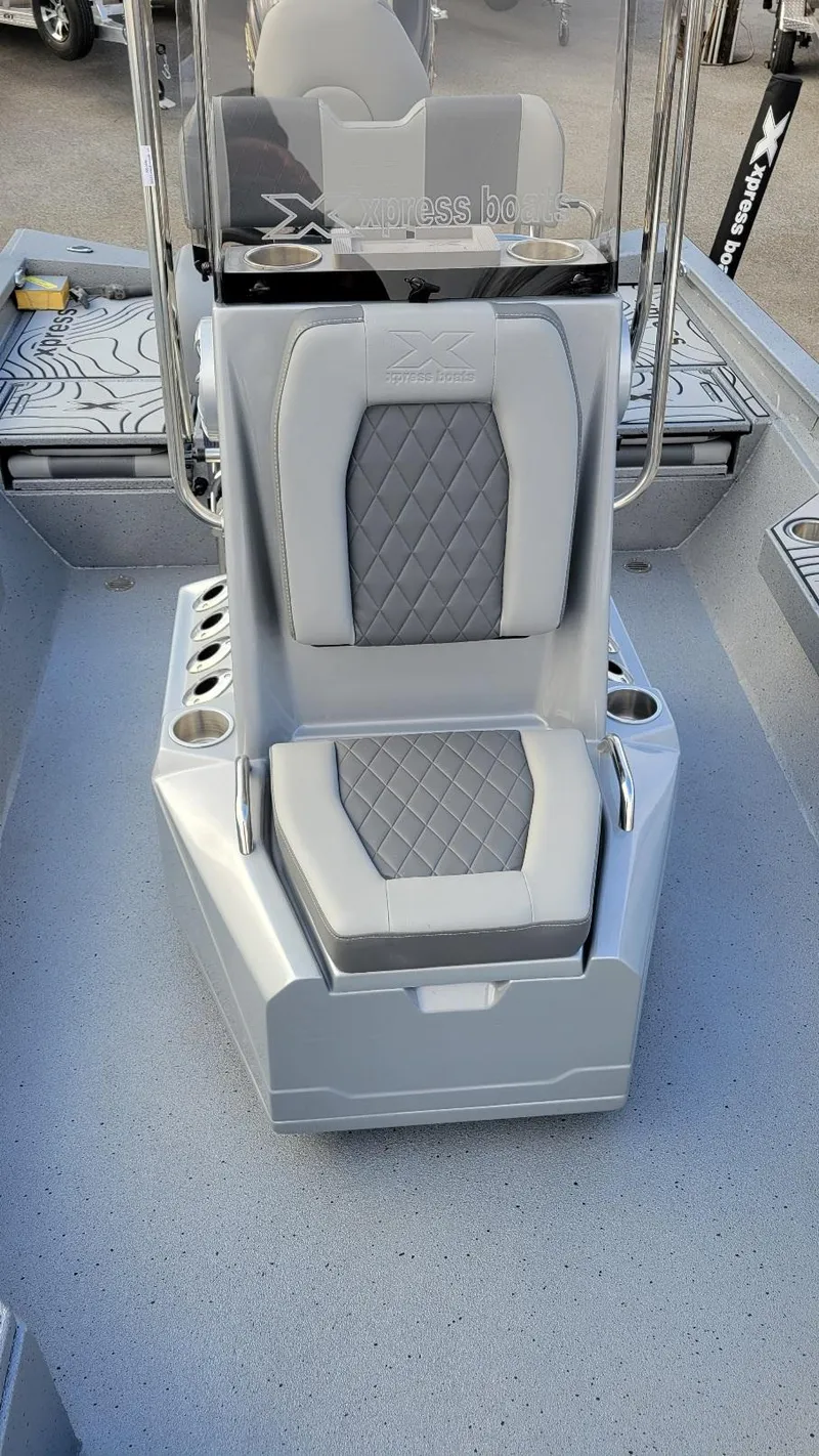 Slide: The Image of 2025 Xpress H22 Bay boat interior with Yamaha Vmax 200 SHO, featuring sleek seating. - 17