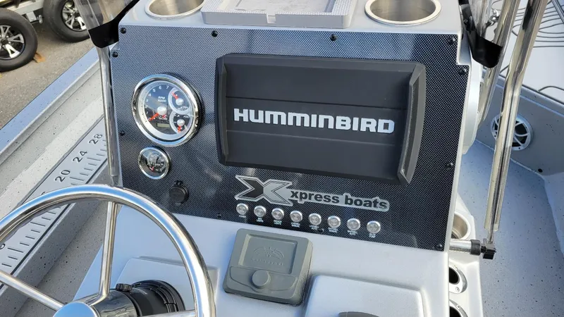 Slide: The Image of 2025 Xpress H22 Bay boat console with Humminbird display and Yamaha Vmax 200 SHO engine. - 21