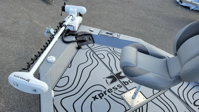 Slide: The Image of 2025 Xpress H22 Bay boat deck with Minn Kota trolling motor and seating. - 5
