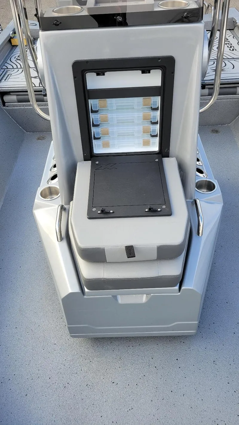 Slide: The Image of 2025 Xpress H22 Bay boat console with storage and cup holders. - 7