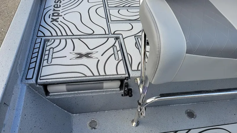 Slide: The Image of 2025 Xpress H22 Bay boat interior with stylish seating and storage compartments. - 9