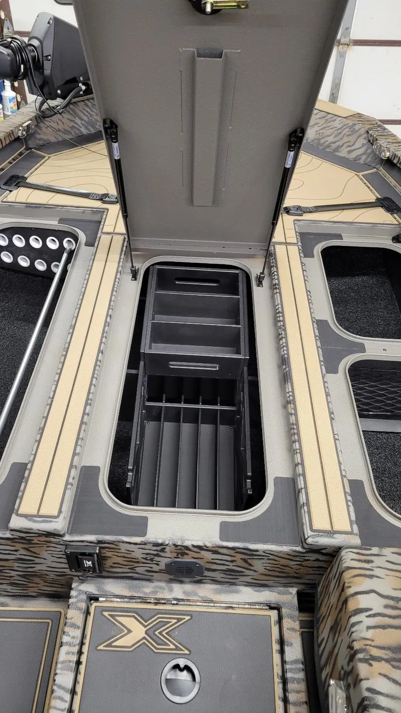 Slide: The Image of 2025 Xpress X19 Pro Bass boat interior storage compartments, featuring Yamaha Vmax 200 engine. - 15