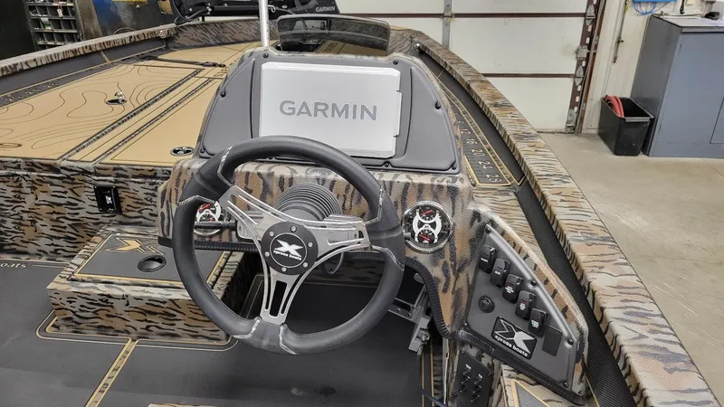 Slide: The Image of 2025 Xpress X19 Pro Bass boat interior with Garmin navigation system. - 22