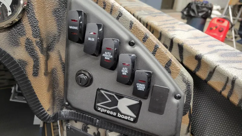 Slide: The Image of Control panel of 2025 Xpress X19 Pro Bass boat with Yamaha Vmax 200. - 23