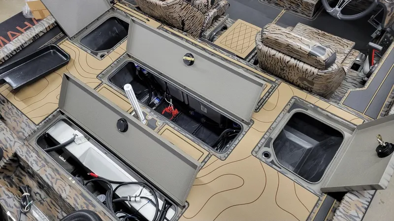 Slide: The Image of 2025 Xpress X19 Pro Bass boat interior with storage compartments and Yamaha Vmax 200 engine. - 6