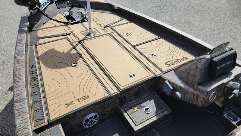 Slide: The Image of 2025 Xpress X19 Pro Bass boat deck with Yamaha 200 Vmax engine, featuring SeaDek flooring. - 13