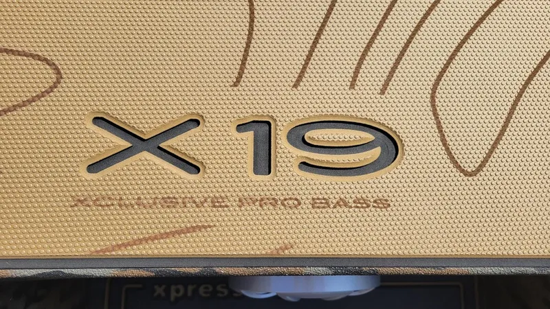 Slide: The Image of 2025 Xpress X19 Pro Bass boat deck with textured surface design. - 15