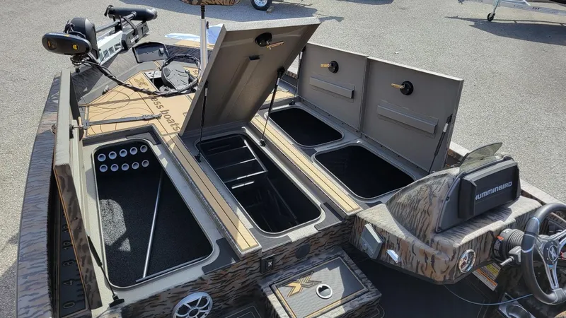 Slide: The Image of 2025 Xpress X19 Pro Bass boat with Yamaha 200 Vmax, open storage compartments. - 5