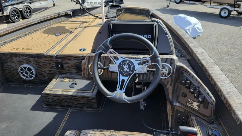 Slide: The Image of 2025 Xpress X19 Pro Bass boat interior with Yamaha 200 Vmax, featuring modern controls. - 7
