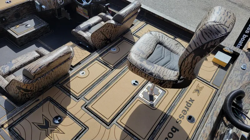Slide: The Image of 2025 Xpress X19 Pro Bass boat interior with camo seats and Yamaha 200 Vmax engine. - 9