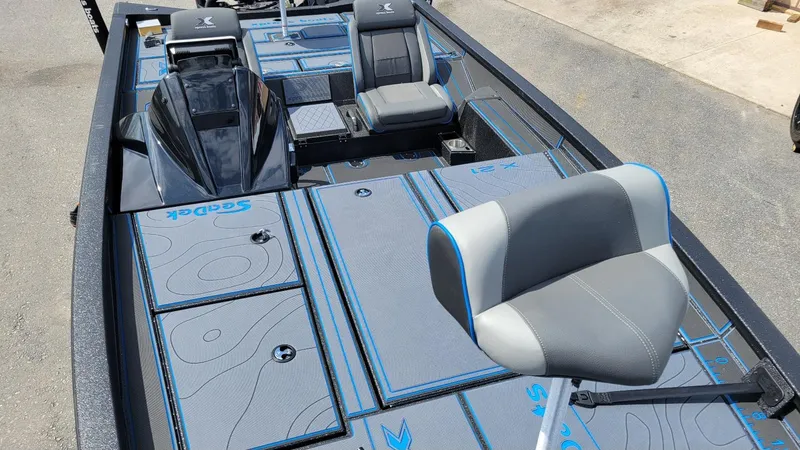 Slide: The Image of 2025 Xpress X21 Pro Bass boat interior with Yamaha Vmax 250, featuring sleek seating and deck design. - 11