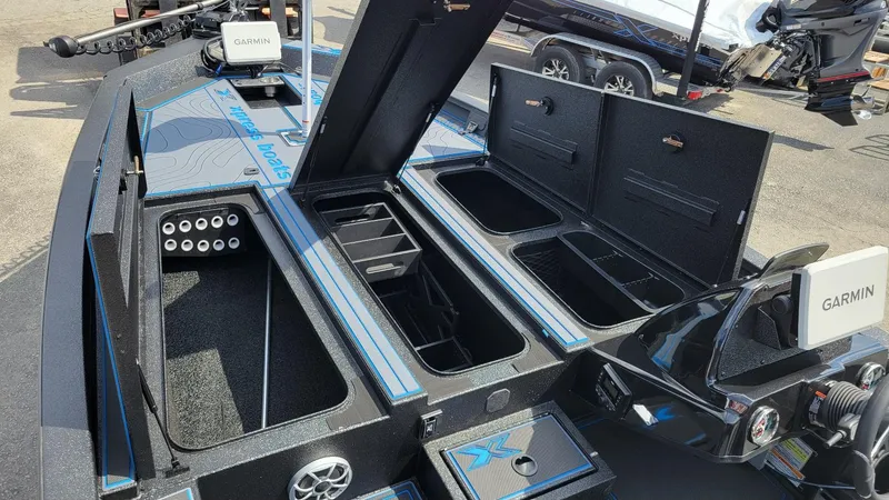 Slide: The Image of 2025 Xpress X21 Pro Bass boat with Yamaha Vmax 250, featuring open storage compartments. - 15