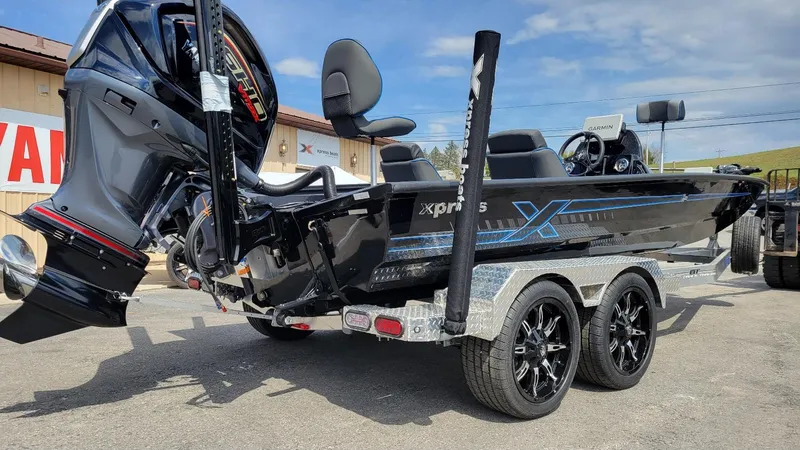 Slide: The Image of 2025 Xpress X21 Pro Bass boat with Yamaha Vmax 250 engine on trailer. - 3
