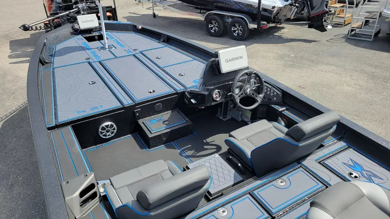 Slide: The Image of 2025 Xpress X21 Pro Bass boat interior with Garmin electronics and Yamaha Vmax 250 engine. - 6