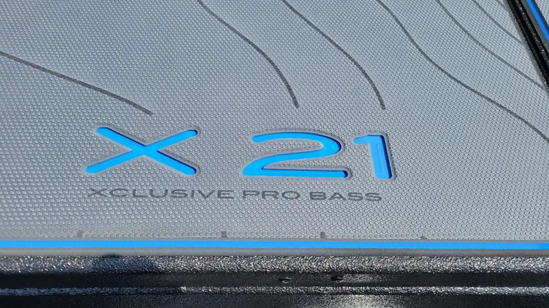 Slide: The Image of 2025 Xpress X21 Pro Bass boat logo detail with textured surface. - 8