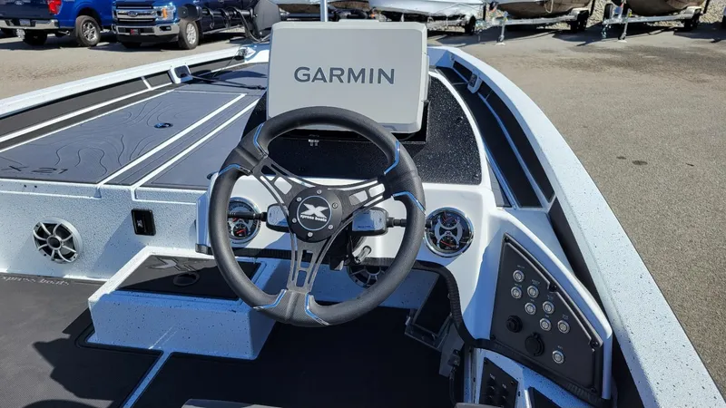Slide: The Image of 2025 Xpress X21 Pro Bass LE boat interior with Garmin display and Yamaha Vmax 250 engine. - 11