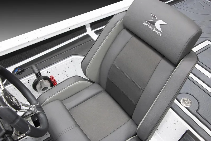 Slide: The Image of Xpress X21 Pro Bass LE 2025 boat seat with steering wheel and control panel. - 12