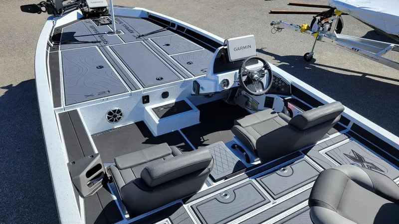 Slide: The Image of 2025 Xpress X21 Pro Bass boat interior with Garmin system and Yamaha Vmax 250 engine. - 17