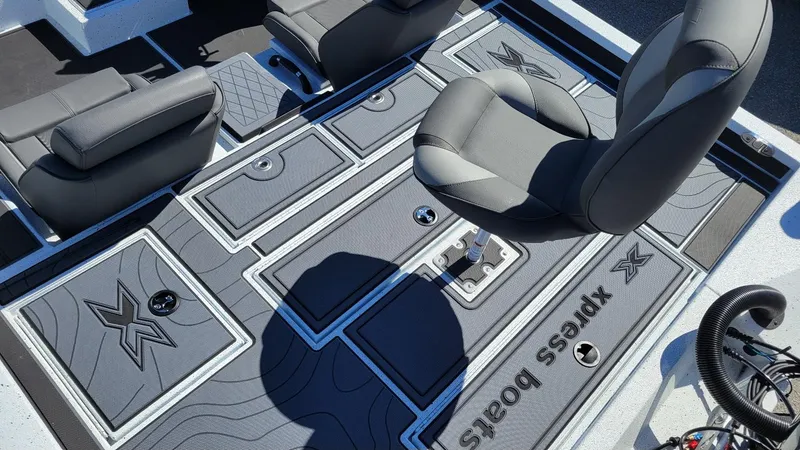 Slide: The Image of 2025 Xpress X21 Pro Bass LE boat interior with Yamaha Vmax 250, featuring sleek seating and storage. - 23
