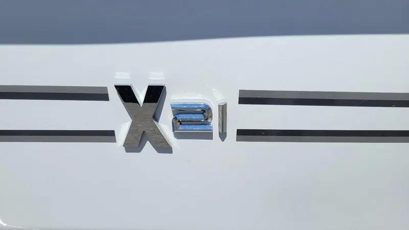 Slide: The Image of 2025 Xpress X21 Pro Bass LE logo on white surface, featuring sleek design elements. - 3
