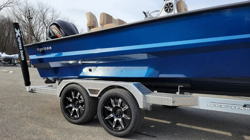 Slide: The Image of 2025 Xpress X23 Bay boat with Yamaha Vmax 200 SHO engine on trailer. - 13