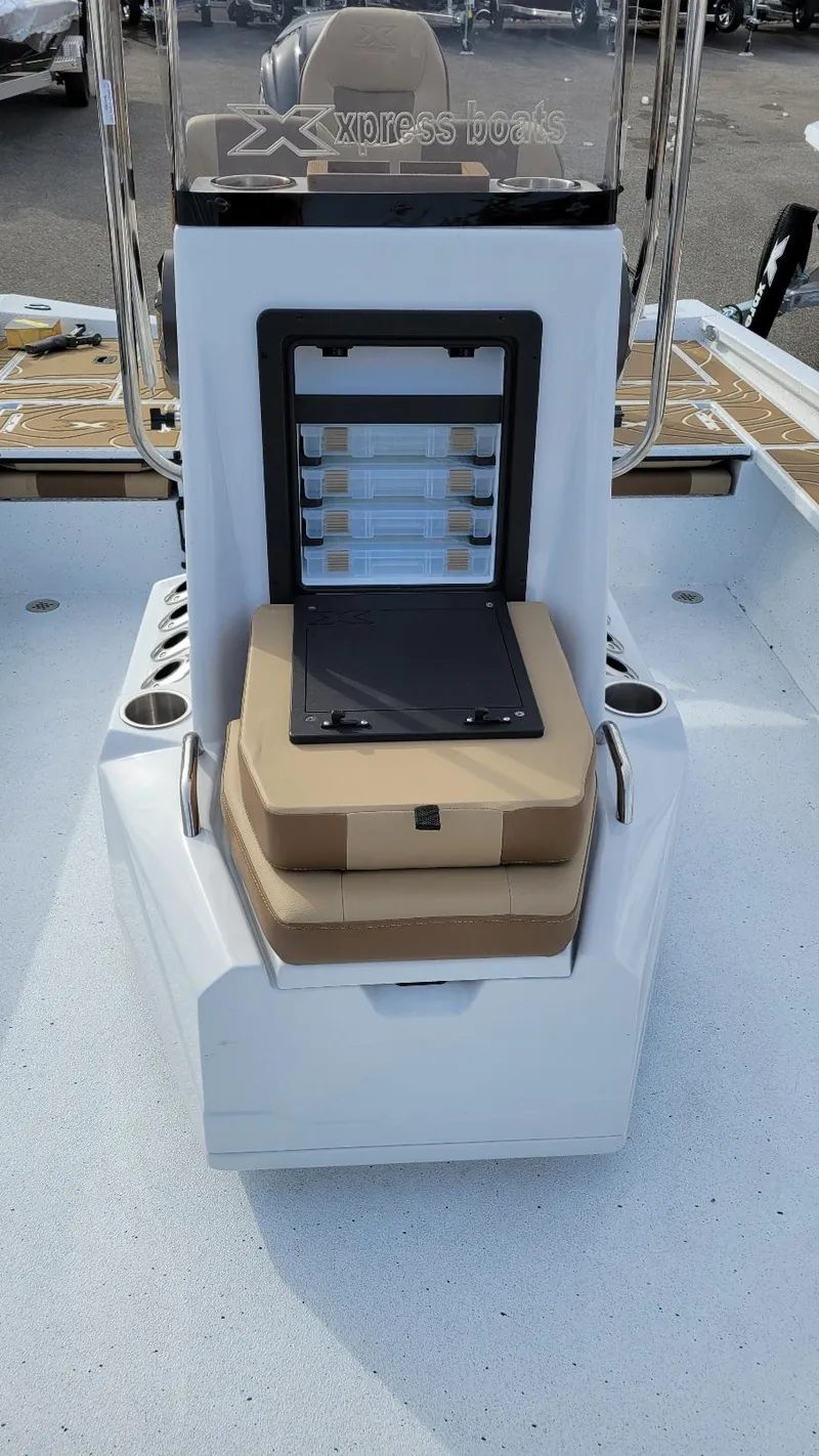 Slide: The Image of 2025 Xpress X23 Bay boat interior with storage and seating, featuring Yamaha Vmax 200 SHO. - 22