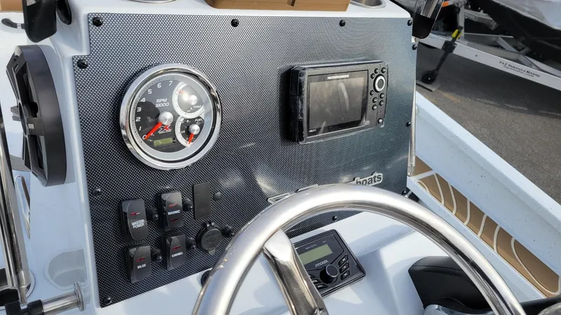 Slide: The Image of 2025 Xpress X23 Bay boat dashboard with Yamaha Vmax 200 SHO controls. - 25