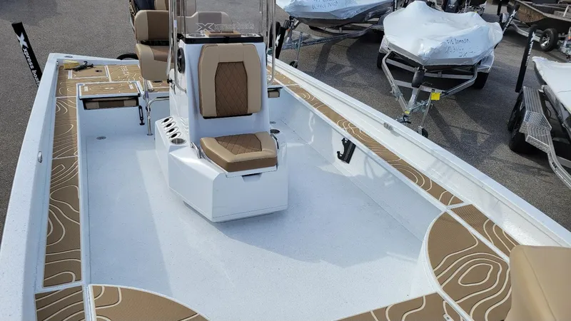Slide: The Image of 2025 Xpress X23 Bay boat with Yamaha Vmax 200 SHO, featuring spacious deck and seating. - 7