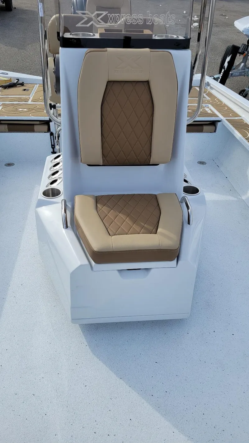 Slide: The Image of 2025 Xpress X23 Bay boat seat with tan diamond-pattern upholstery. - 8