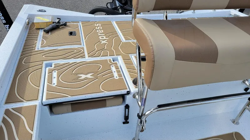 Slide: The Image of 2025 Xpress X23 Bay boat interior with tan seating and deck, featuring Yamaha Vmax 200 SHO. - 9