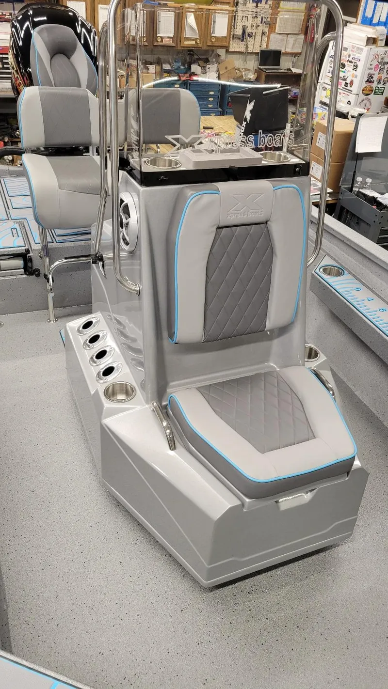 Slide: The Image of 2025 Xpress H22 Bay boat interior with Yamaha Vmax 200 SHO, featuring sleek seating and modern design. - 11