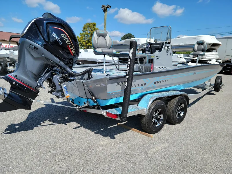 Slide: The Image of 2025 Xpress H22 Bay boat with Yamaha Vmax 200 SHO engine, parked outdoors. - 15