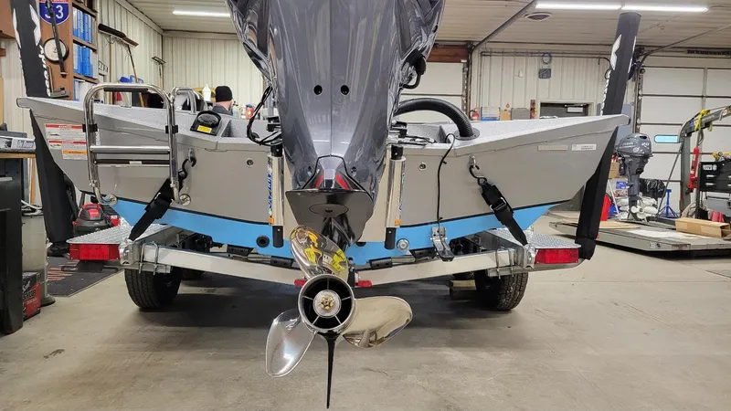 Slide: The Image of 2025 Xpress H22 Bay boat with Yamaha Vmax 200 SHO engine in a garage. - 18