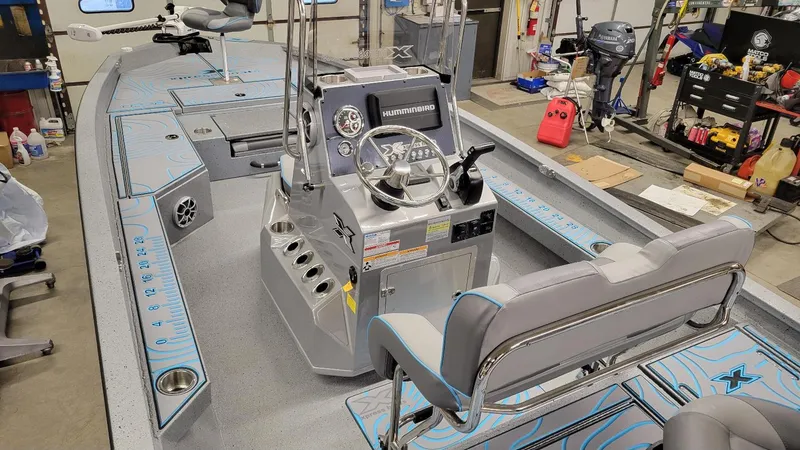 Slide: The Image of 2025 Xpress H22 Bay boat interior with Yamaha Vmax 200 SHO engine, featuring advanced controls. - 20