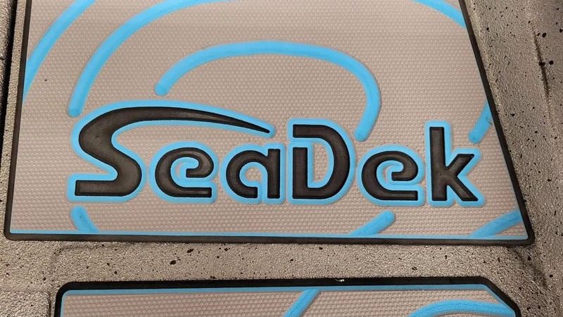Slide: The Image of SeaDek logo on Xpress H22 Bay boat flooring, 2025 model with Yamaha Vmax 200 SHO. - 21