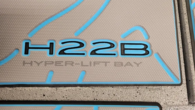 Slide: The Image of 2025 Xpress H22 Bay Hyper-Lift logo with blue accents. - 22