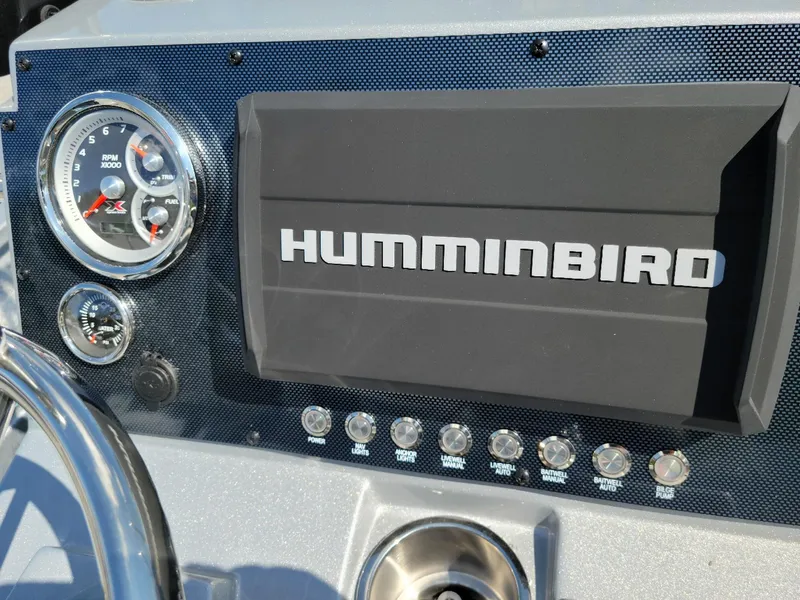 Slide: The Image of Dashboard of 2025 Xpress H22 Bay boat with Humminbird display and gauges. - 3