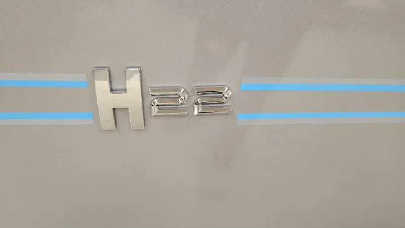 Slide: The Image of 2025 Xpress H22 Bay emblem with blue stripes, featuring Yamaha Vmax 200 SHO. - 4