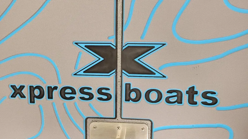 Slide: The Image of Xpress Boats logo on textured background, featuring 2025 H22 Bay model with Yamaha Vmax 200 SHO. - 7