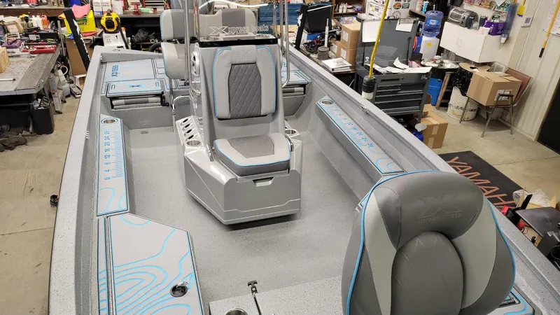 Slide: The Image of 2025 Xpress H22 Bay boat interior with Yamaha Vmax 200 SHO engine, in stock. - 9