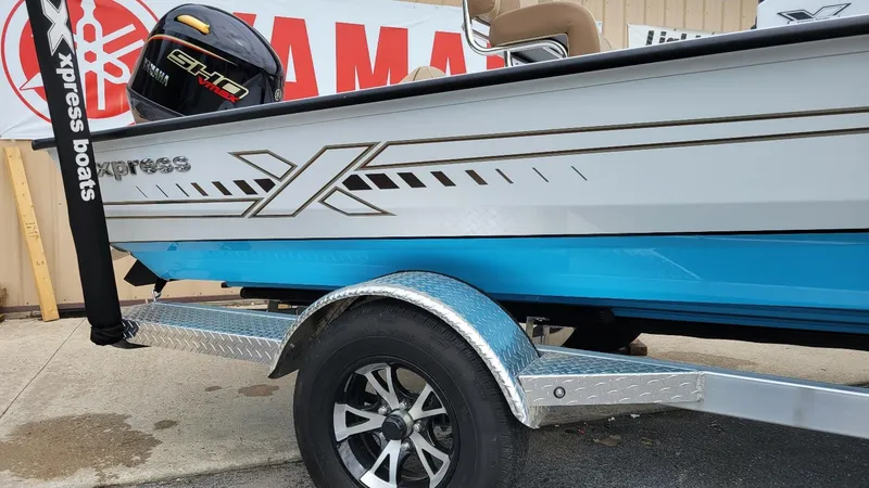 Slide: The Image of 2025 Xpress H20 Bay boat with Yamaha Vmax 115 SHO engine on trailer. - 10