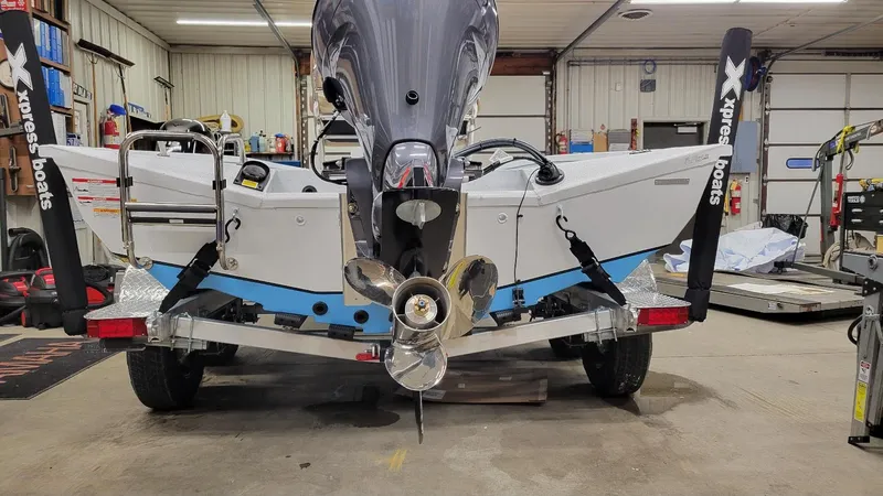 Slide: The Image of 2025 Xpress H20 Bay boat with Yamaha Vmax 115 SHO in a garage. - 11