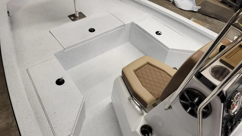 Slide: The Image of 2025 Xpress H20 Bay boat interior with Yamaha Vmax 115 SHO, featuring seating and storage. - 12