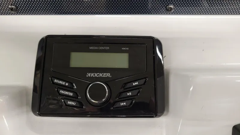 Slide: The Image of Kicker KMC45 media center on 2025 Xpress H20 Bay boat dashboard. - 21