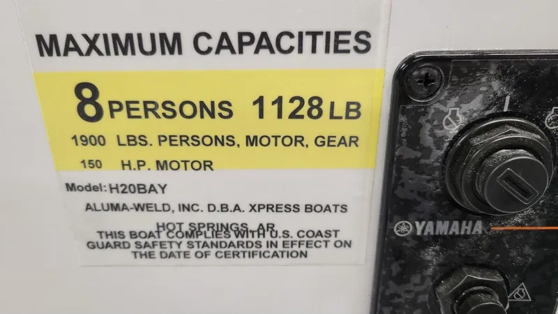Slide: The Image of 2025 Xpress H20 Bay boat capacity label, Yamaha Vmax 115 SHO engine details. - 7